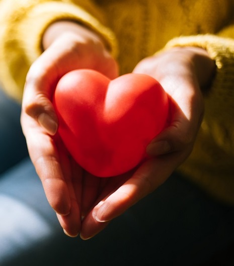 Woman holding red heart