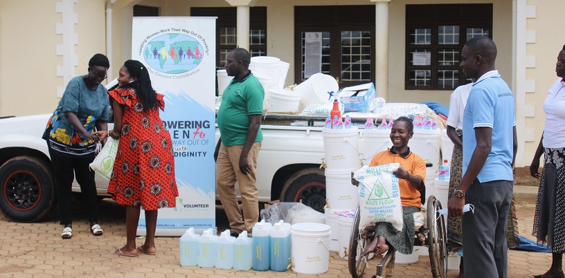 People delivering pandemic supplies to Uganda.