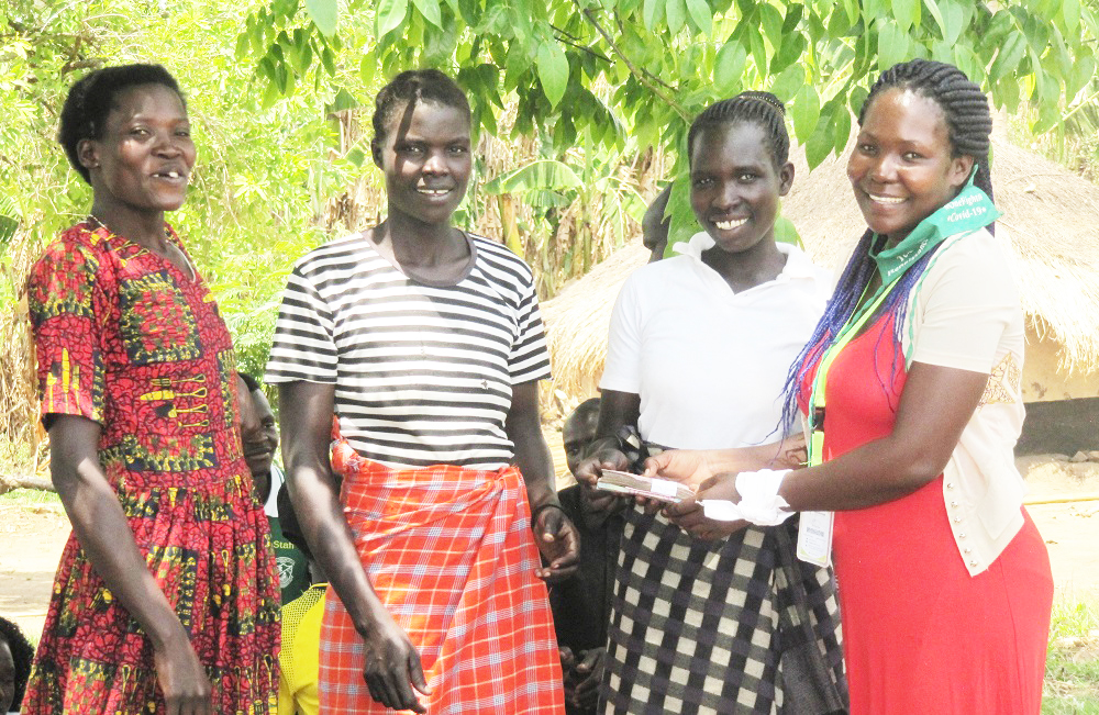 Toffister presenting loan to 3 other women.