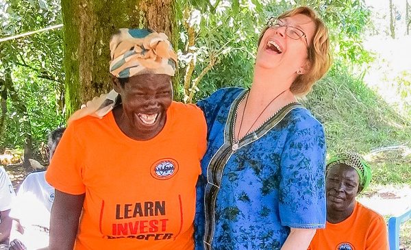 Two women laughing together.