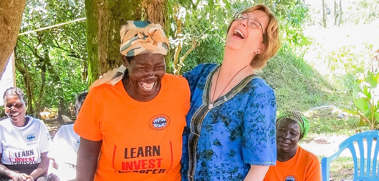 Two women laughing together.