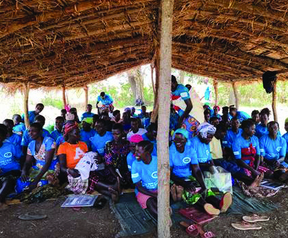 Ugandan women gather to attend an adult literacy class